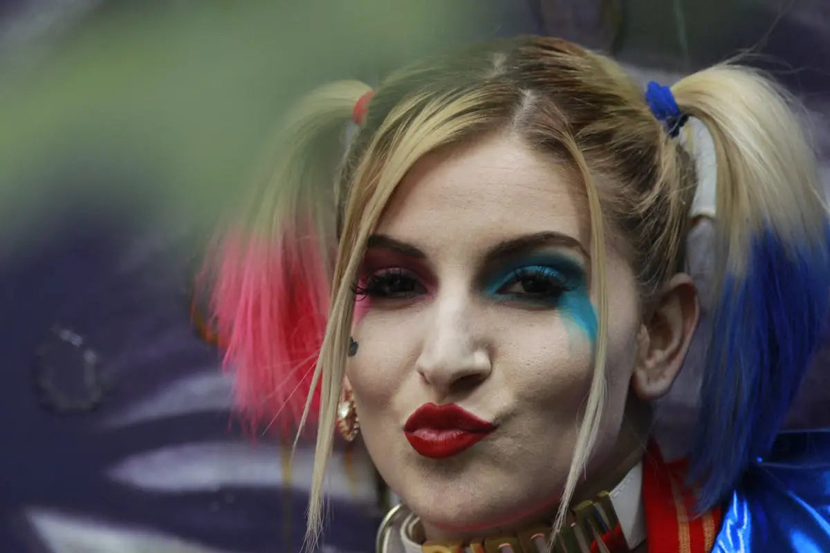 A sleek, modern wristwatch with a black leather strap and silver casing, displaying a minimalist white dial and silver hour markers.