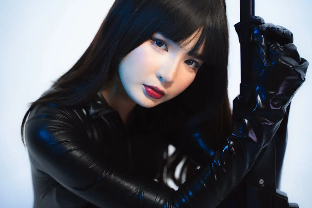 A sleek, modern smartwatch with a black strap and digital display showing time and fitness metrics, placed on a minimalist white surface.