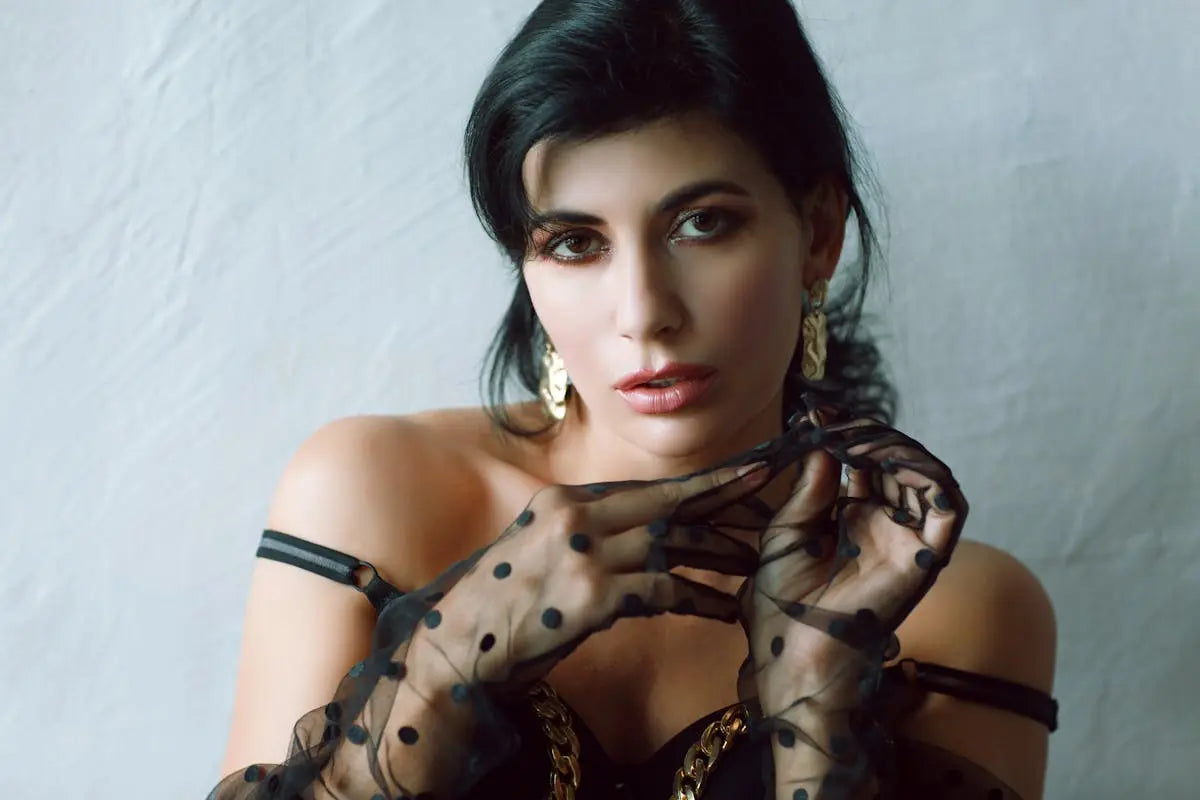 A cozy living room setup with a modern gray sofa, a wooden coffee table, and a plush rug, creating an inviting, comfortable atmosphere.