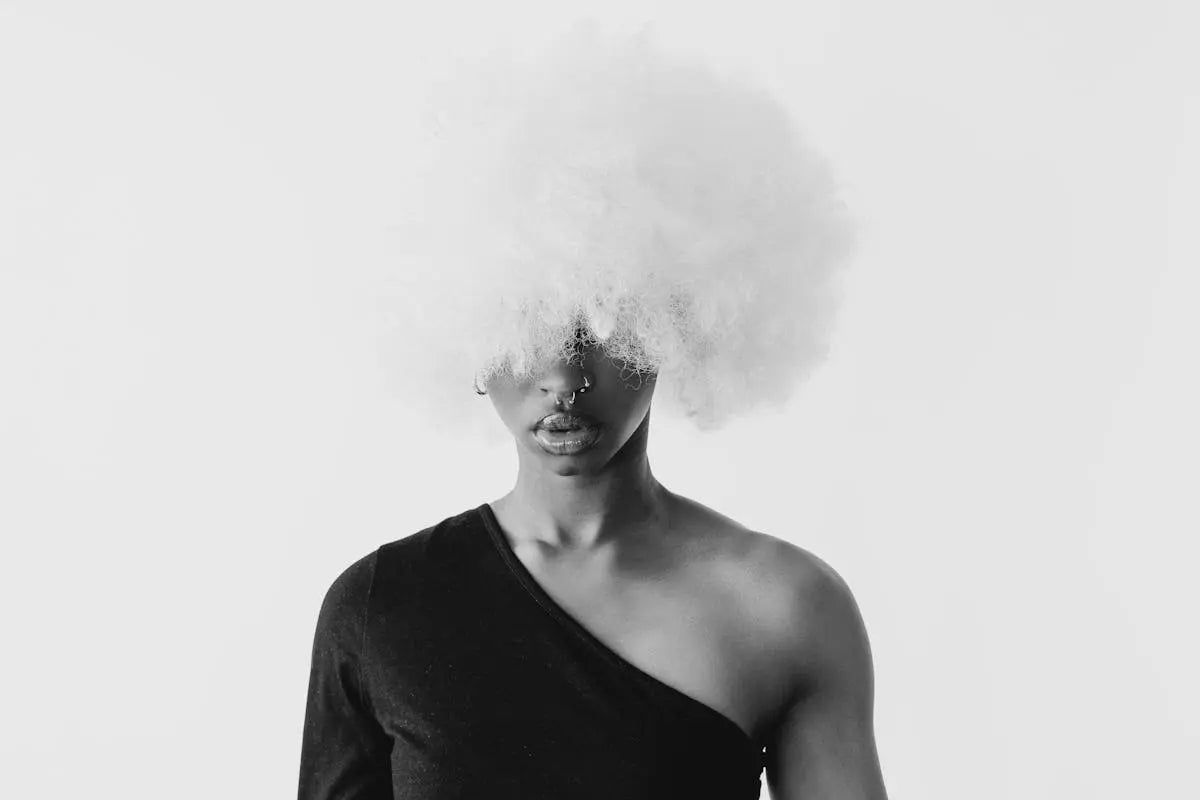 A sleek black leather wallet with multiple card slots and a minimalist design, displayed open to show the interior compartments.