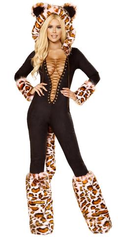 A woman in a stylish garment wearing a tiger hat and furry boots, with a close-up of a giraffe visible in the background.