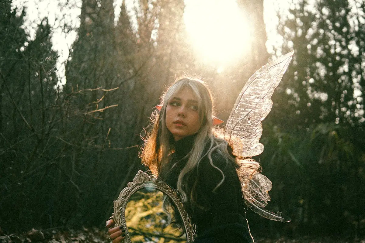 A stylish wristwatch with a leather strap, featuring a minimalist black dial and silver hour markers, displayed on a textured wooden surface.