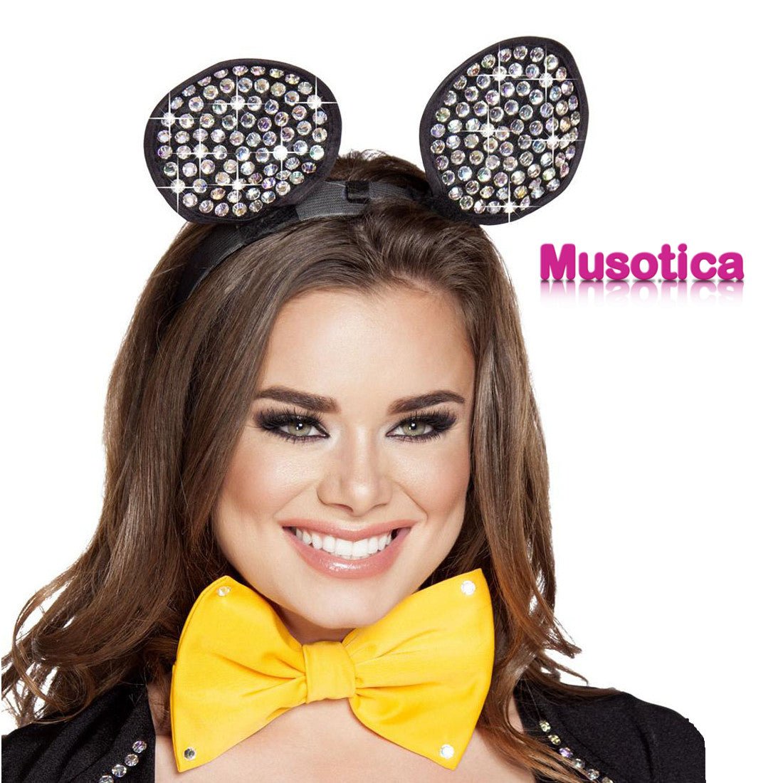 A woman smiling, wearing a fashion accessory bow tie and mouse ears, highlighted with lipstick, captured during a photo shoot.