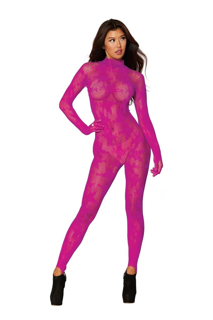 A woman wearing a pink bodysuit stands confidently, showcasing fashion-forward activewear. She pairs the outfit with matching footwear, embodying a stylish, modern look.
