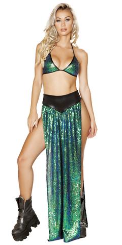 A blonde woman models a stylish outfit, featuring a close-up of a patterned dress and a fashionable boot, showcasing modern fashion design.