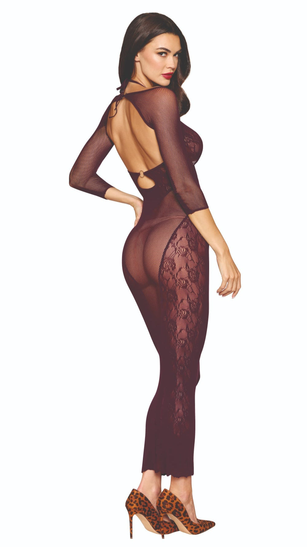 Woman in seamless knitted bodystocking gown with lace and fishnet patterns, featuring halter neck, keyhole cutouts, and separate fishnet shrug, wearing high heels.