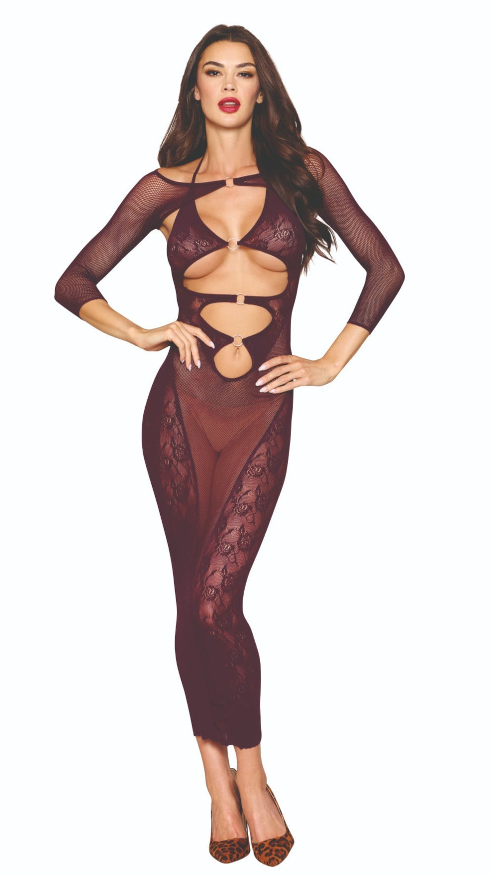 Woman in a seamless knitted bodystocking gown with halter neck ties and keyhole cutouts, paired with a separate fishnet shrug, showcasing leopard print shoes.