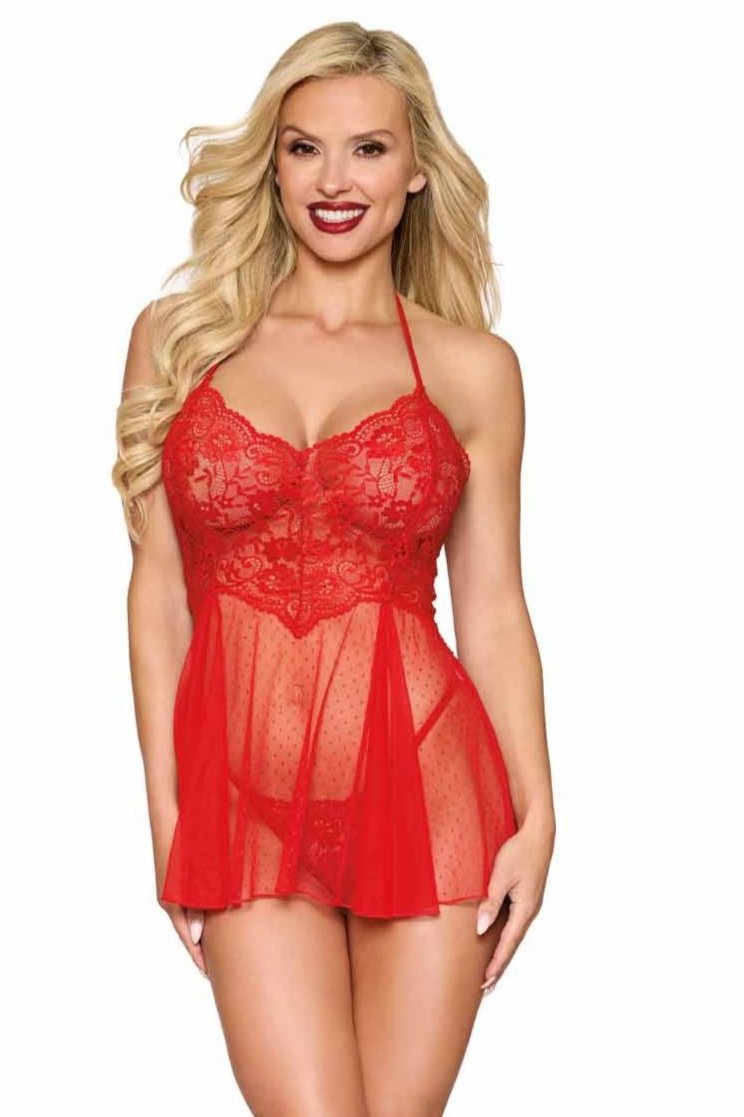 Woman modeling Dot Mesh and Lace Babydoll with G-string, showcasing the stretch lace bodice and playful dot mesh skirt, highlighting the lingerie set's elegance and allure.