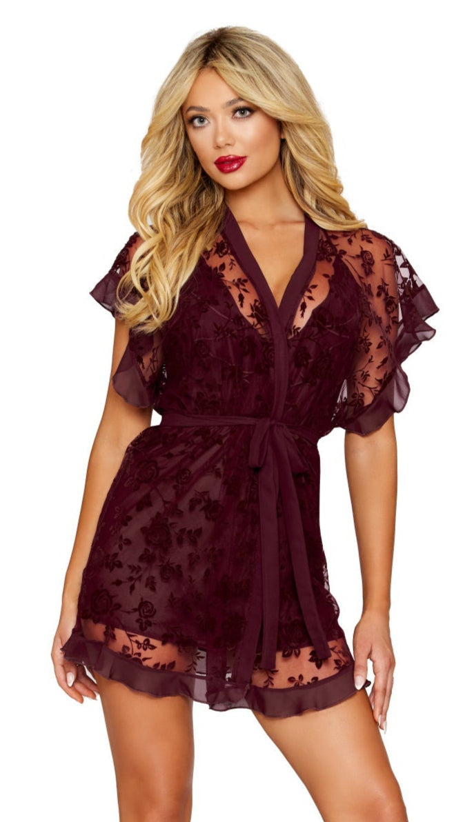 Woman modeling a floral flocked mesh and chiffon robe and chemise set with flounce details, featuring a plunging neckline and adjustable crisscross straps.