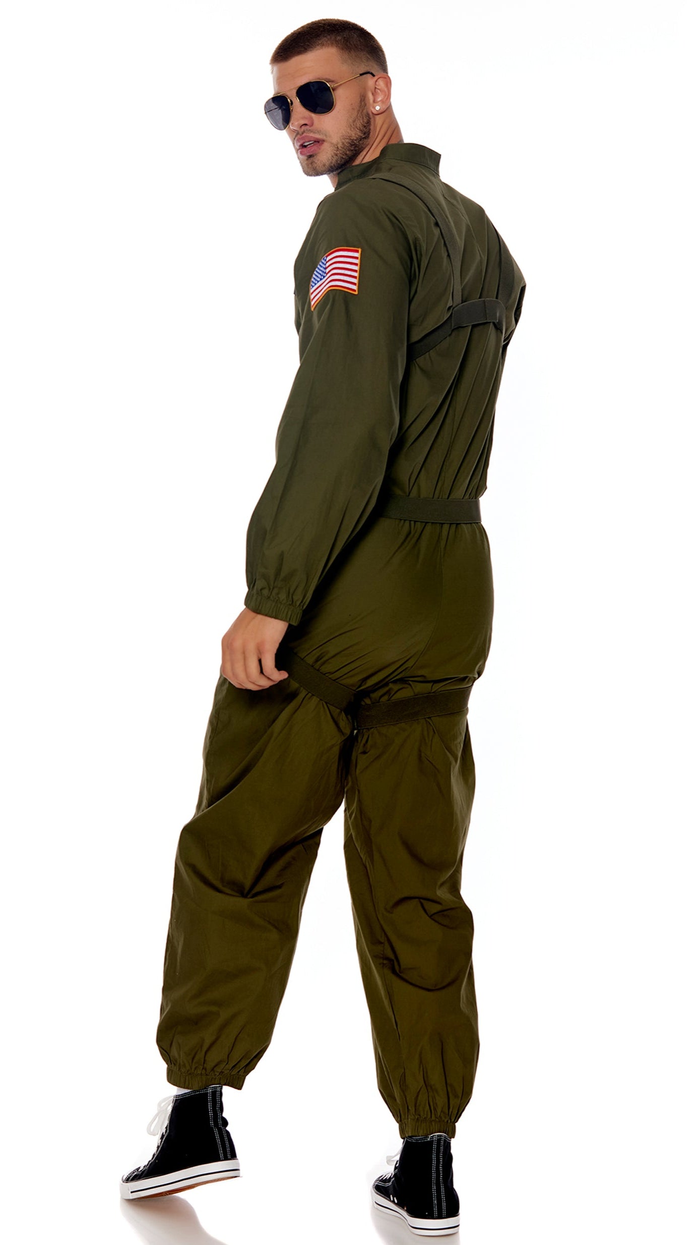 Close-up of the Flight or Fight Men's Movie Character Costume, highlighting the jumpsuit with ornamental patches, harness, and sunglasses worn by a man.