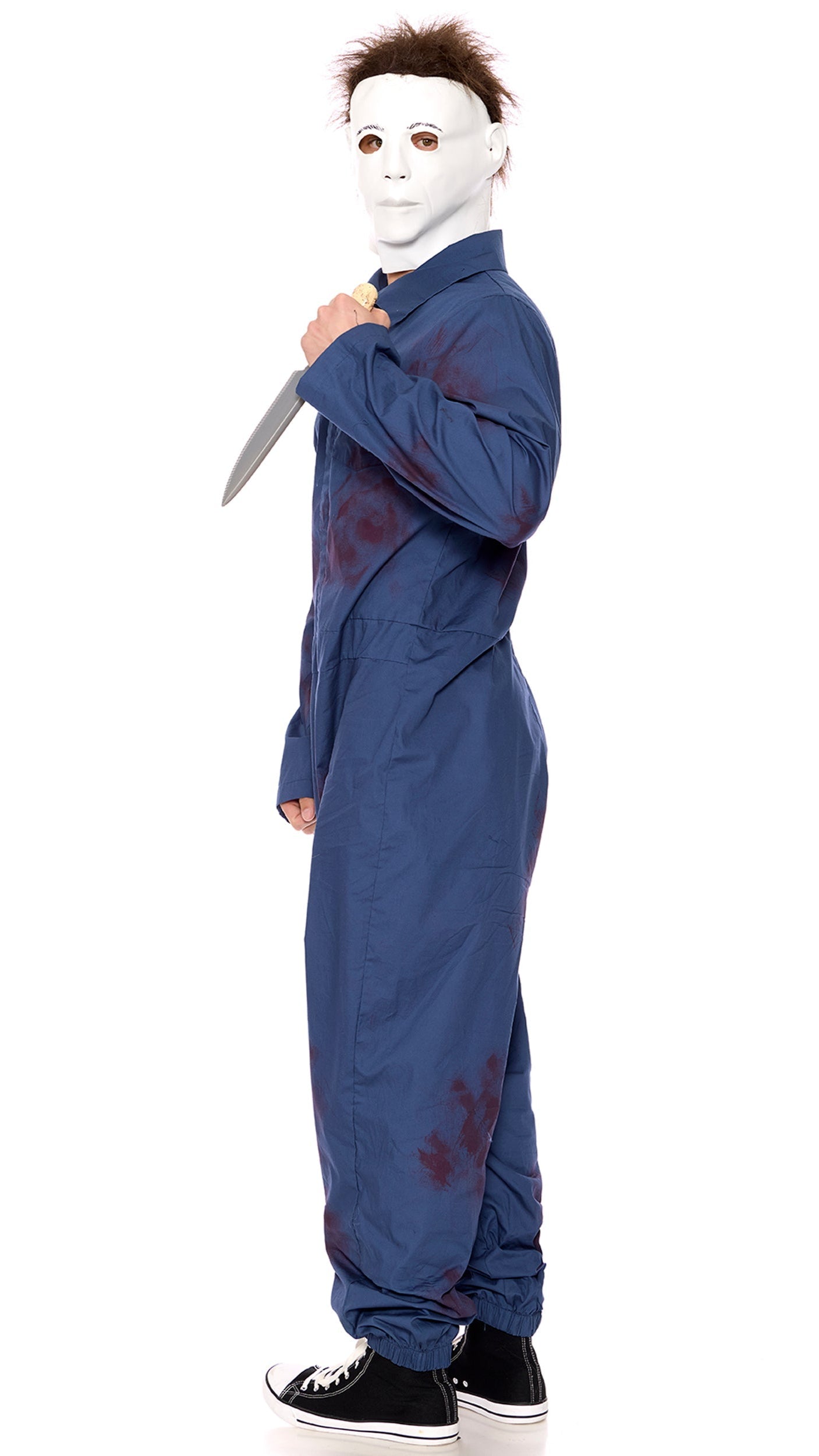 Pure Evil Men's Movie Character Costume featuring a jogger jumpsuit with blood splatter design, full mask, and prop knife, showcased by a person in blue attire.