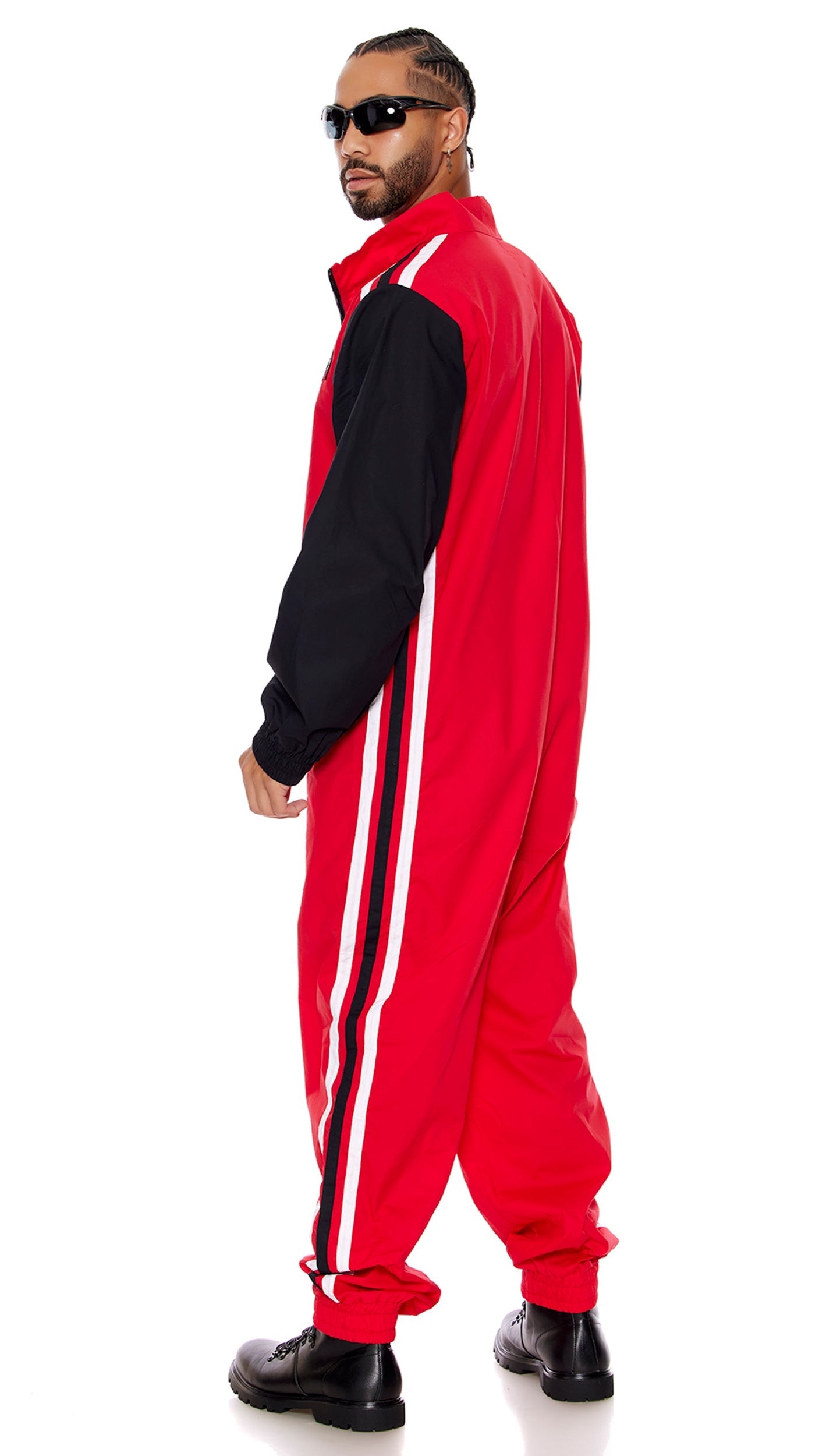 Full Throttle Men's Racer Costume featuring a close-up of the poplin zipfront jumpsuit with embroidered patches and elastic hem, plus glasses.