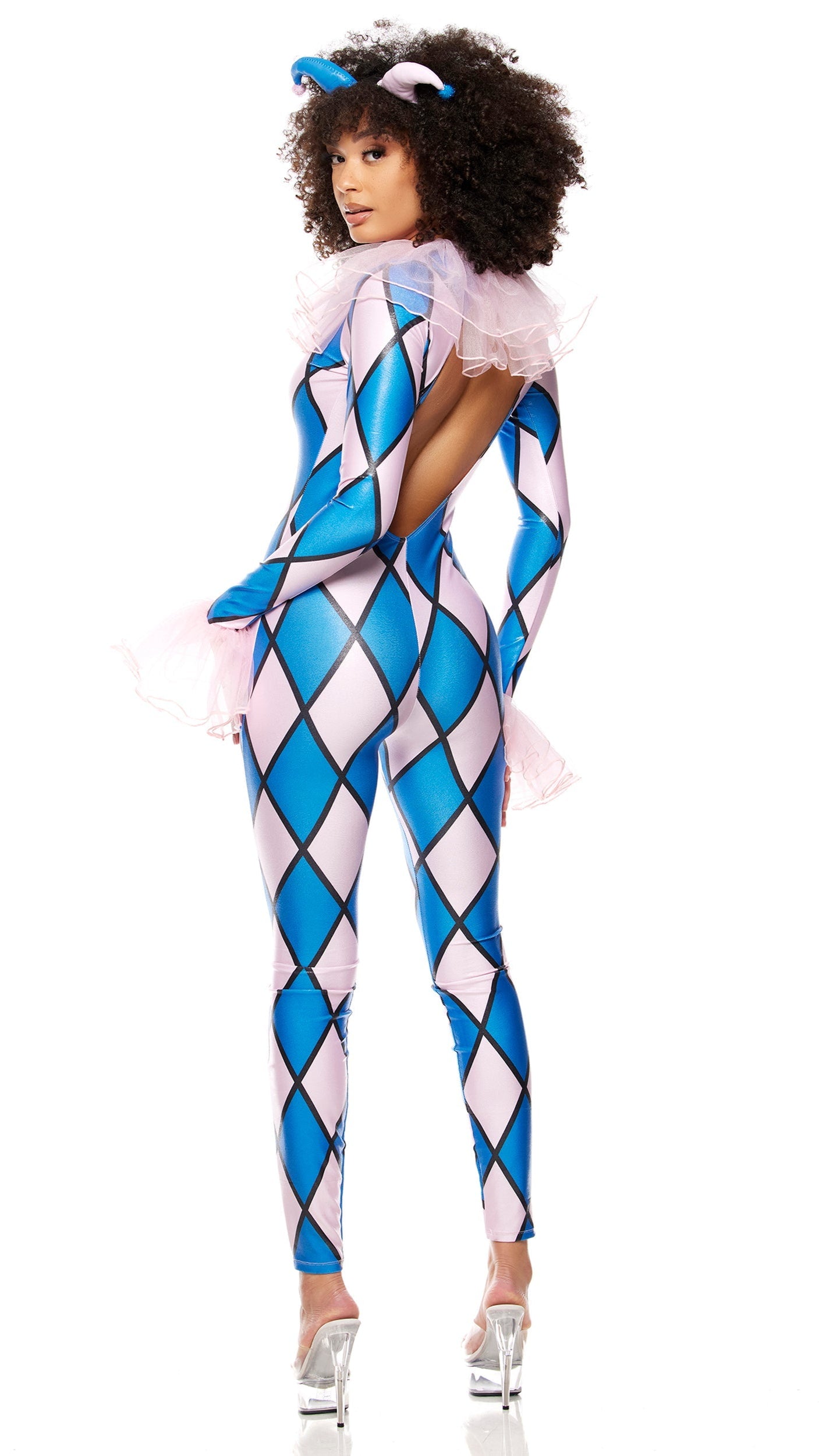 Woman models the Take a Jest Clown Costume: a diamond print jumpsuit with ruffle trim and zip-back, paired with a jester headband.