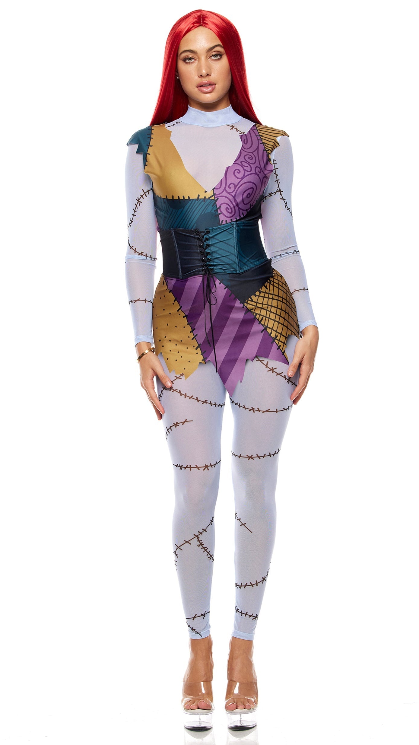 Woman wearing the Stitched Up Movie Character Costume, featuring a sheer mesh mockneck bodysuit, leggings, patchwork print dress, and lace-up waist cincher.