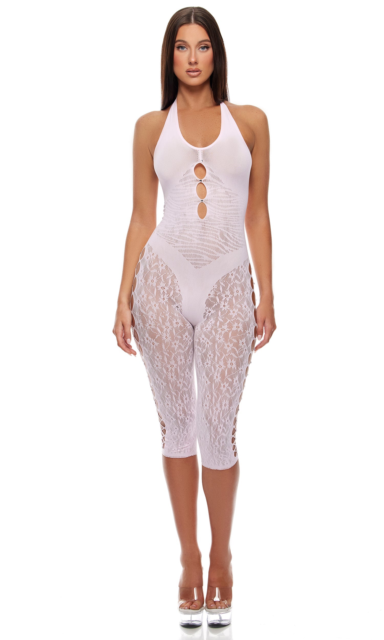 Cross Your Mind Capri Bodystocking features a halterneck design with cut-outs on the torso, semi-sheer lace leggings, opaque bra and panty outlines, and rhinestone accents, worn with clear platform sandals.
