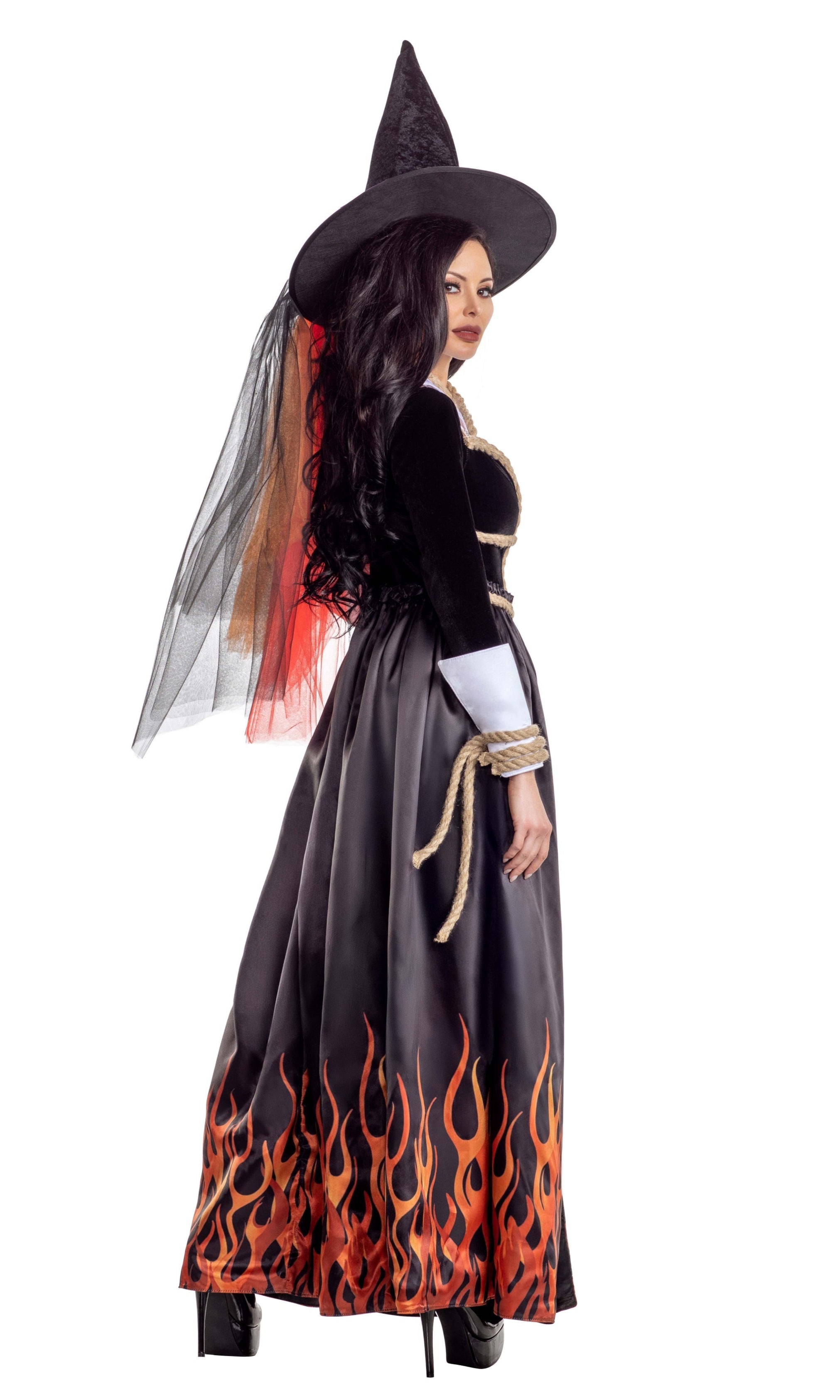 Woman wearing Hellfire Witch velvet teddy with fire skirt and pilgrim collar, accessorized with matching garters and hat.