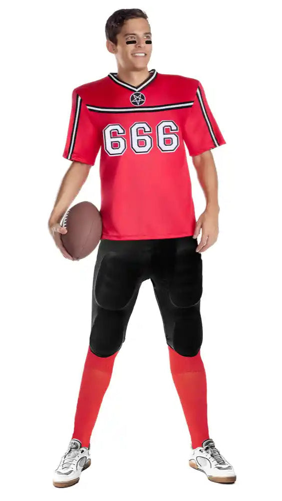 Person holding Hellbent Football Player jersey with shoulder pads, pentagram patches, 666 on chest, paired with football pants and socks.