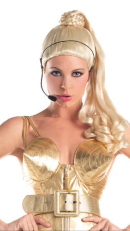 A model showcases the 80s Diva Wig, styled with a fashion-forward look, highlighting its retro appeal and enhancing the elegance of her gold dress.