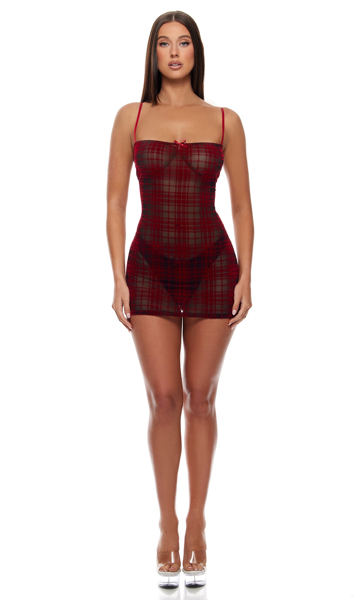 Velvet Lines Plaid Chemise Lingerie Set featuring a sheer plaid mesh chemise with spaghetti straps, bow detail, and picot trim, paired with a matching high-leg thong panty. Model wears clear platform heels.