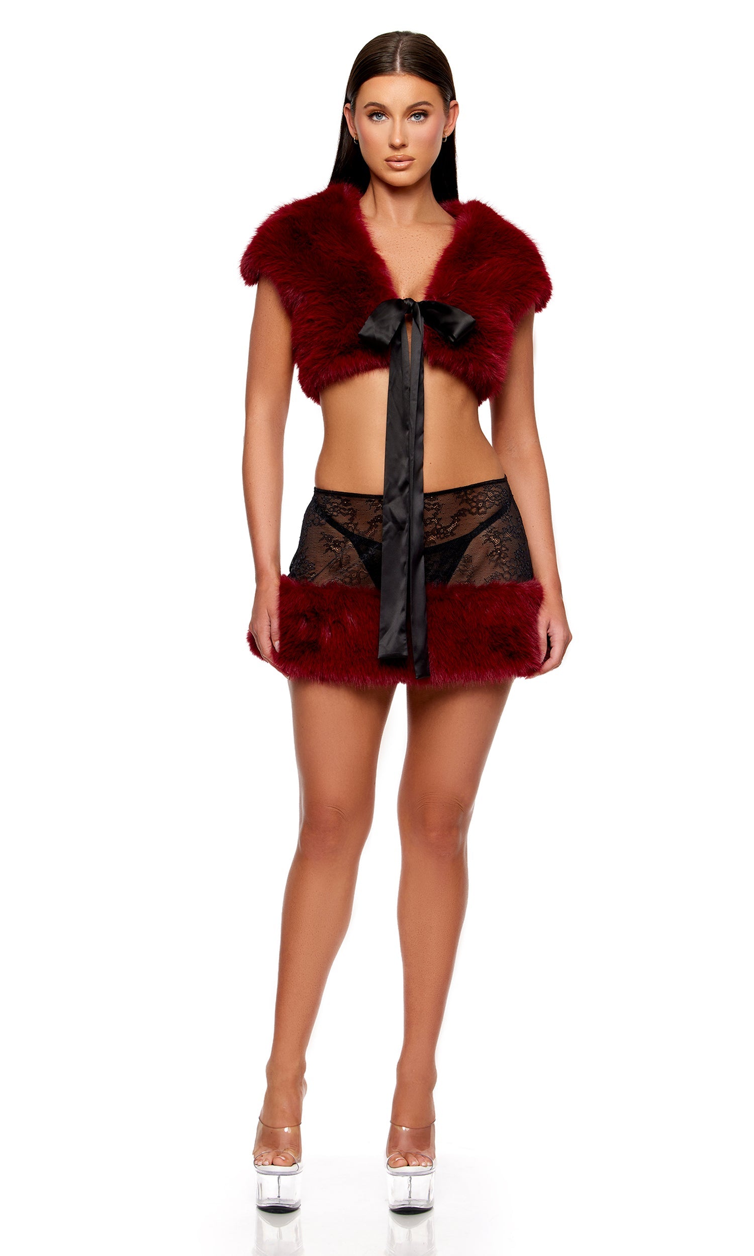 Fur The Night Lace and Faux Fur Shrug and Mini Skirt Set features a faux-fur shrug with satin tie, paired with a lace mini skirt and matching thong, worn by a model.