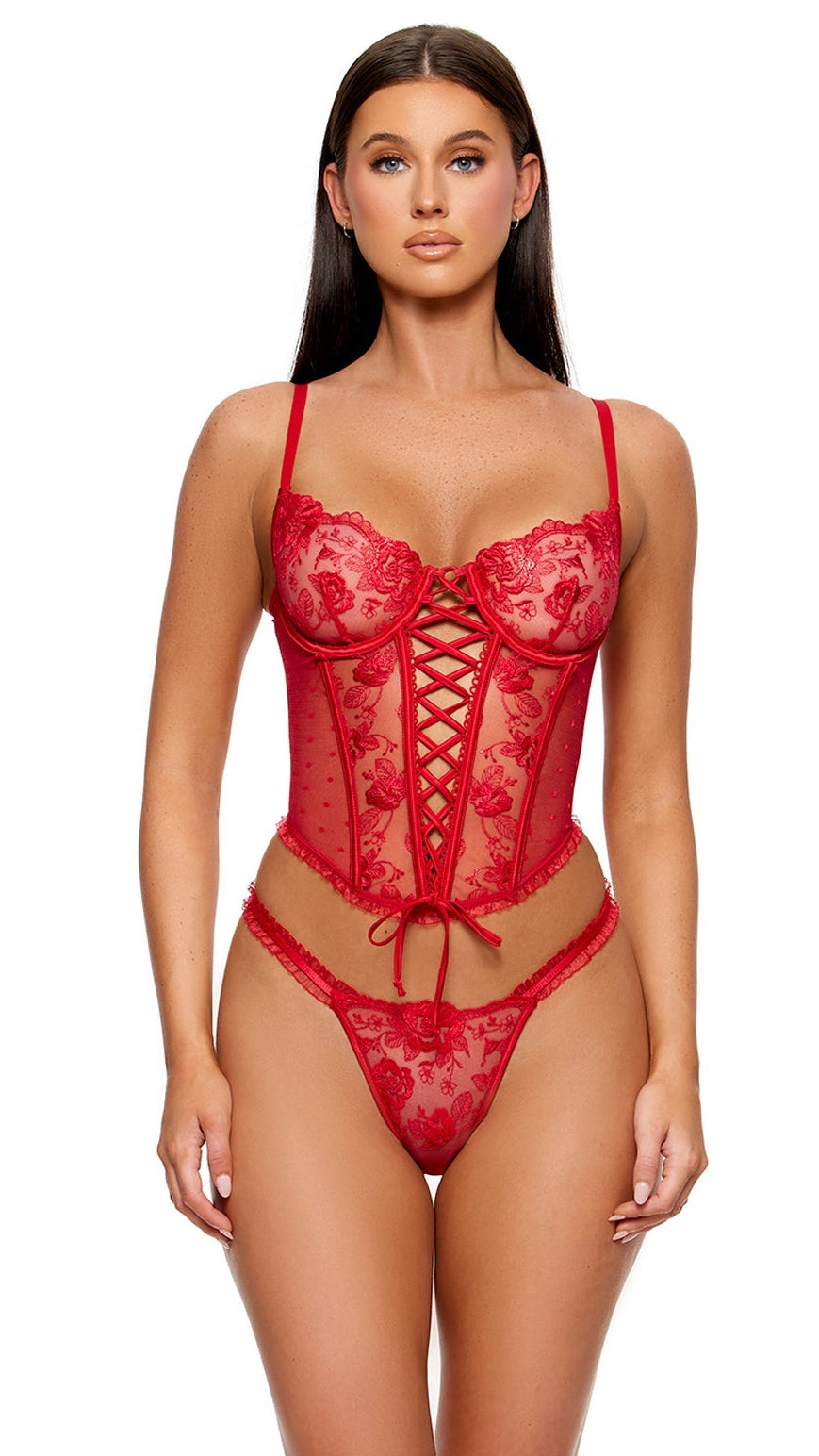 La Vie en Rose Metallic Embroidered Bustier Set features a corset-style top with floral embroidery, underwire cups, and lace-up front, paired with a matching thong, modeled by a woman.