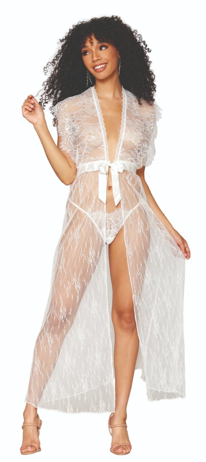 Woman in a Chic White Lace Cover-Up, featuring eyelash lace, open sides, and a satin tie-front, enhancing a seductive lingerie look.