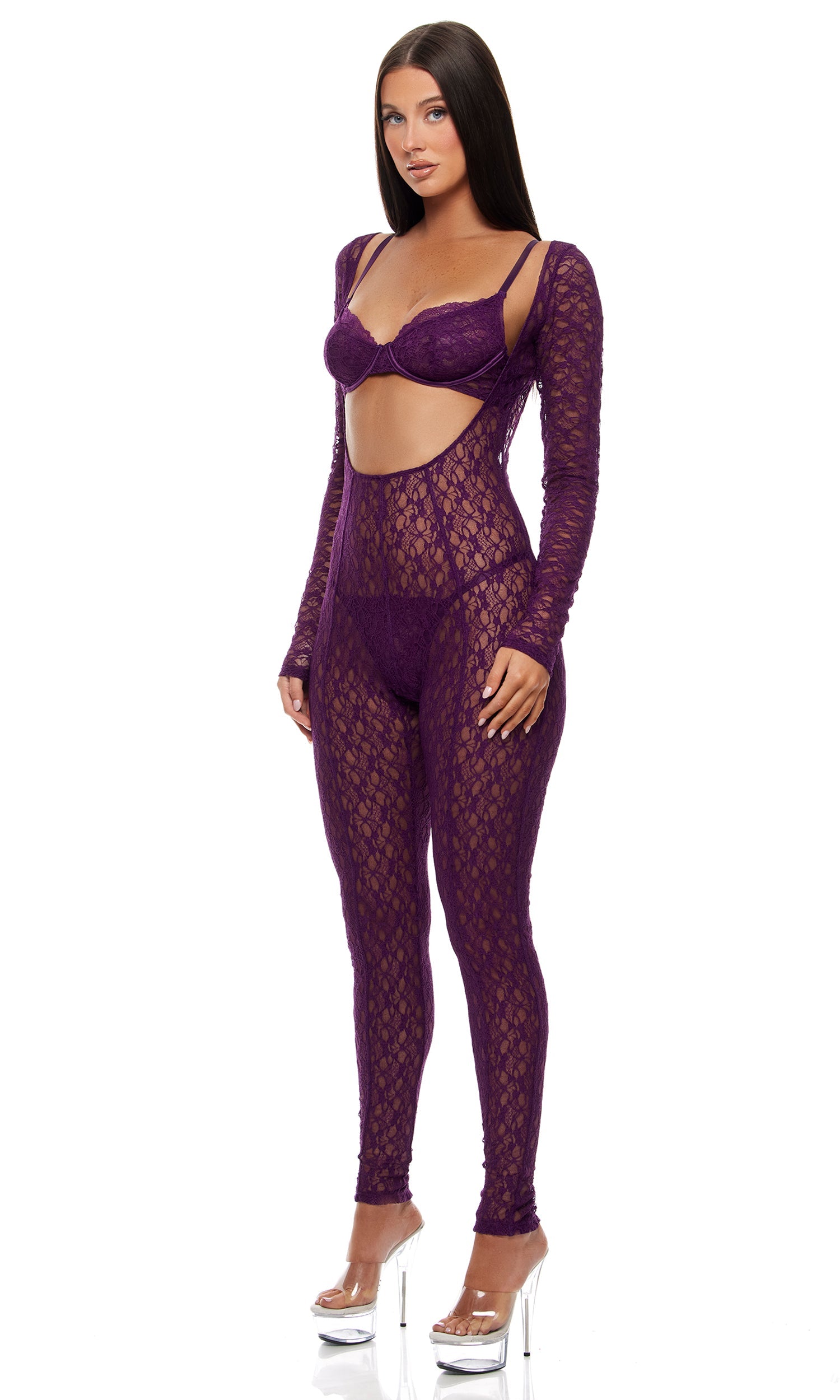 Feel Me Textured Lace Jumpsuit Lingerie Set features a lace catsuit with a midriff cut-out, paired with an underwire lace bra and G-string panty, styled with clear platform heels.