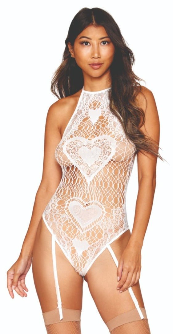 Woman modeling the Heart Patterned Seamless Knit Teddy, featuring a high halter neck and adjustable garters, showcasing its playful heart accents and seamless knit design.