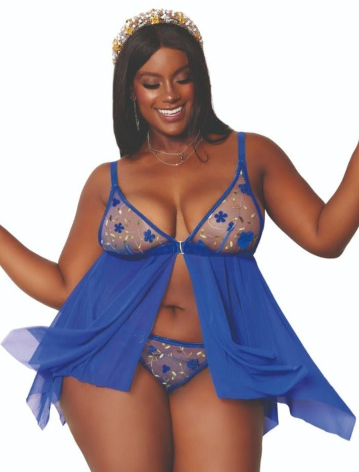 Woman modeling a Plus Size 3D Babydoll G-string Set with floral embroidery, adjustable straps, and hook closure, emphasizing the lingerie’s unique design and fit.