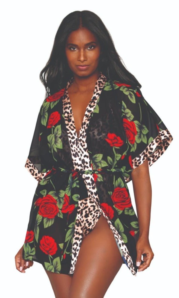 Woman modeling the Rose Print Chiffon Robe & Leopard Print Teddy Set, featuring a floral kimono-style robe and fun, open-back teddy. Ideal for stylish nights in.