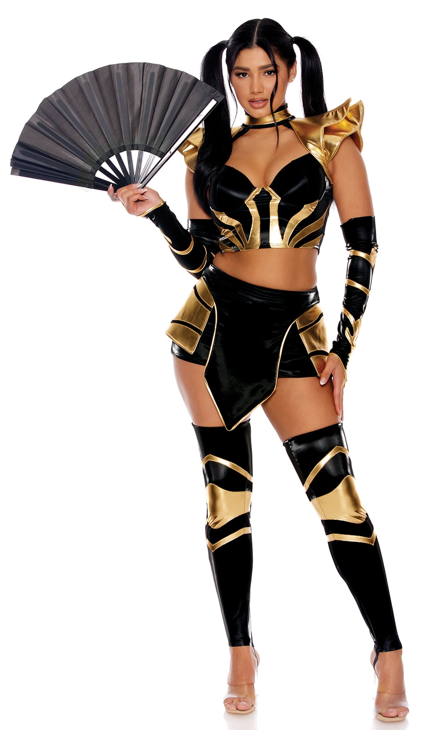 Woman in Sexy Stealth Ninja Assassin Halloween Costume, featuring a structured top, skirt, leg accessories, fingerless gloves, and holding a fan.