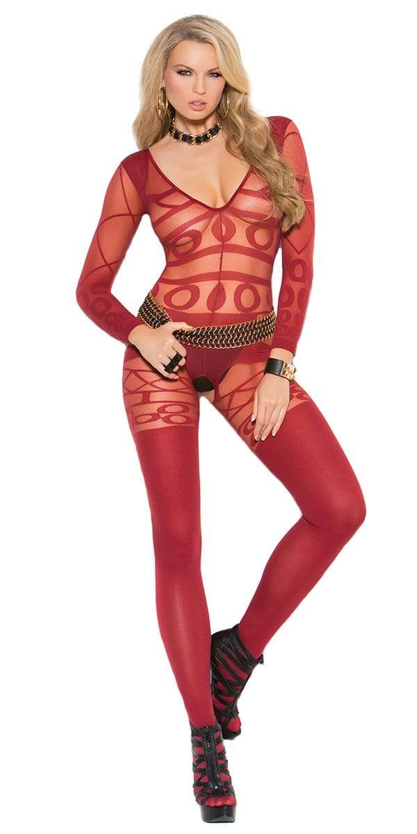 A woman models the Lovelace Long Sleeve Bodystocking, featuring a body-hugging, see-through design with opaque accents, accompanied by high heels and a gold belt.