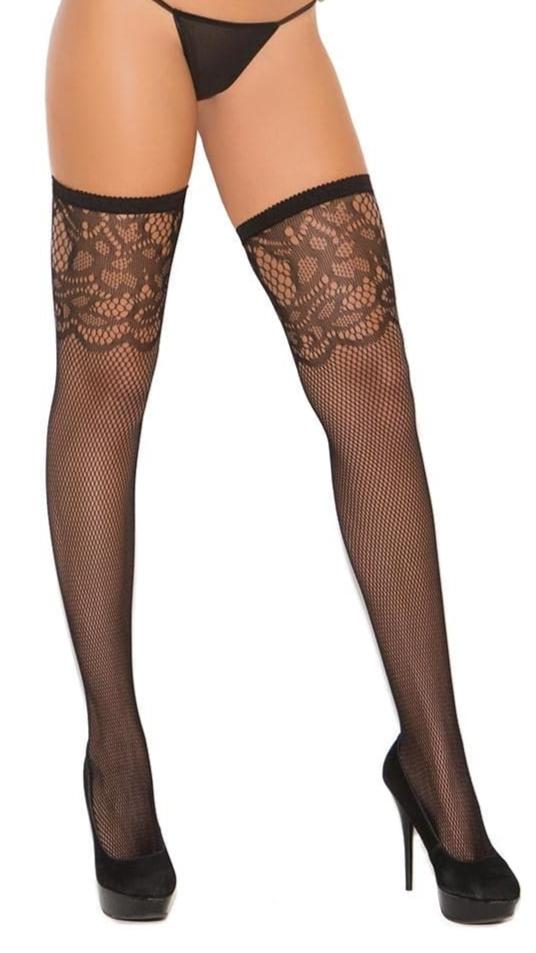 Woman wearing Plus Size Fishnet Thigh Hi with Scroll Lace Top, styled with black fishnet stockings and a gold jacket, highlighting fashion-forward lingerie.