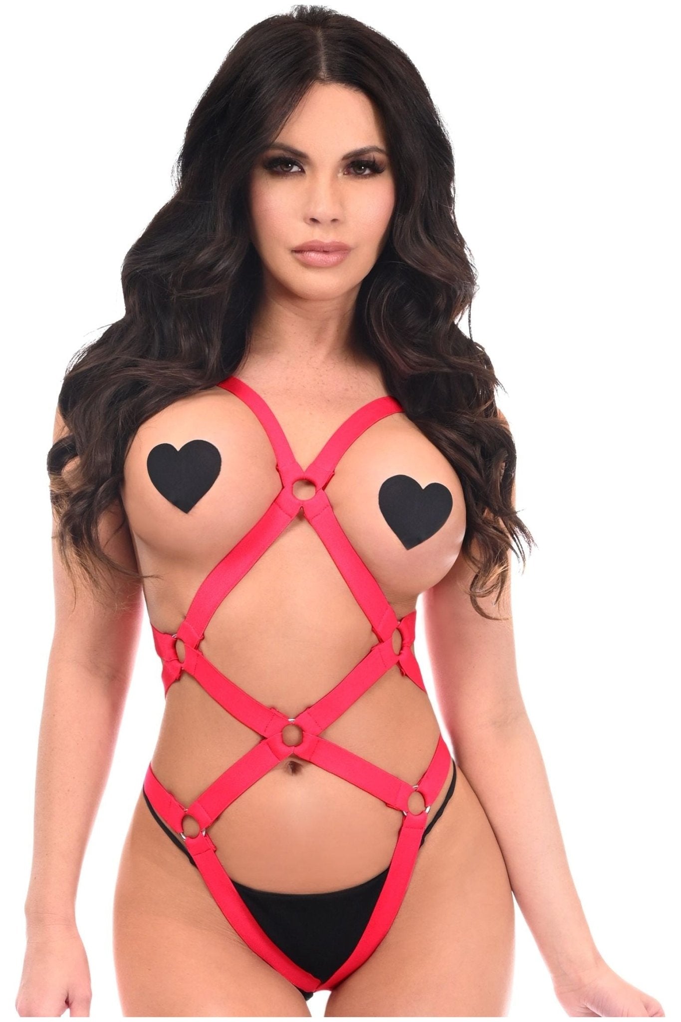 Woman wearing Red Bondage Body Harness Bodysuit with Silver Detailing, featuring a sleek silhouette, black heart designs, and premium hardware.