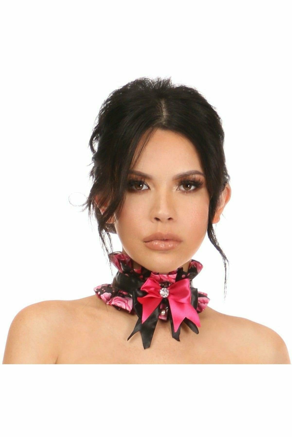 Close-up of a woman wearing the Sexy Pink Floral Satin Costume Choker, featuring a pink and black bow with rhinestone and bell embellishments.