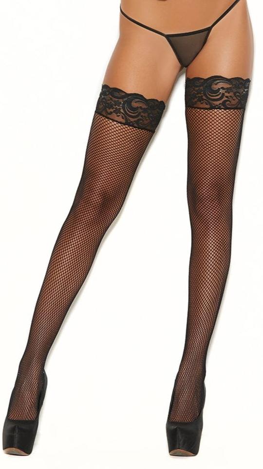 Stay Up Fishnet Thigh Highs Stockings with silicone lace top, shown worn by a woman, highlighting their fit and style.