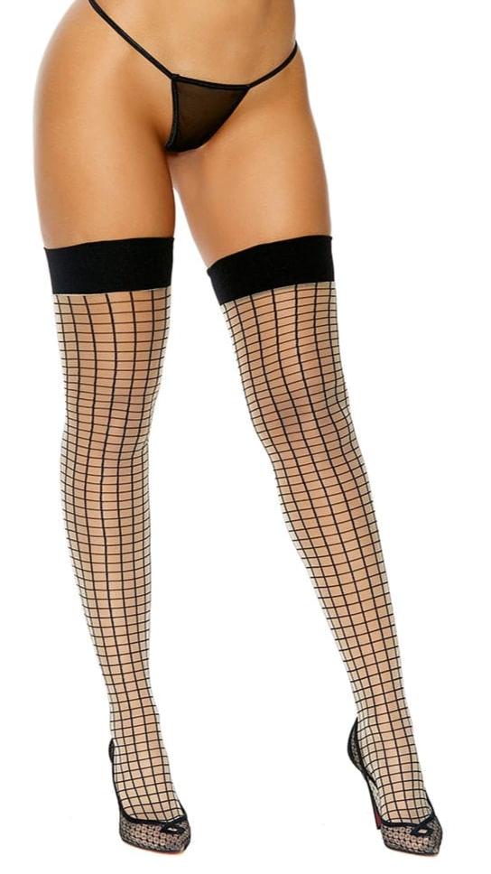Woman modeling Stay Up Nude & Black Striped Thigh Highs with window pane pattern and silicone top, highlighting the stylish, comfortable fit of the thigh highs.