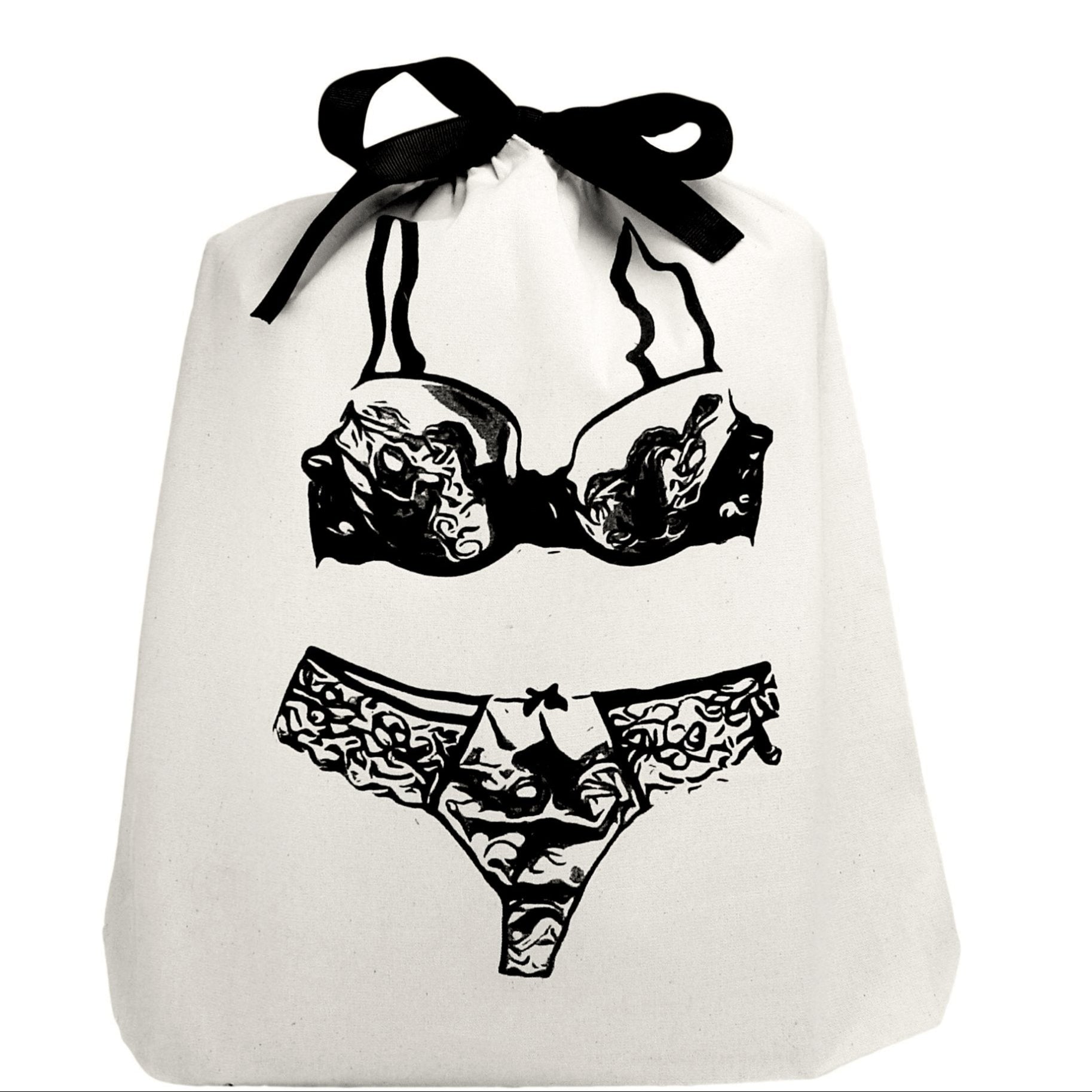 The Feeling Sensational Bundle features a stylish white bag with intricate black and white designs, including sketches and ribbons, hinting at luxurious lingerie surprises inside.