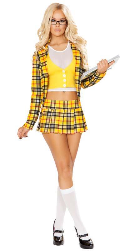 A woman with blonde hair, wearing glasses, holds a laptop. She is dressed in a yellow shirt and plaid miniskirt, holding a pen.