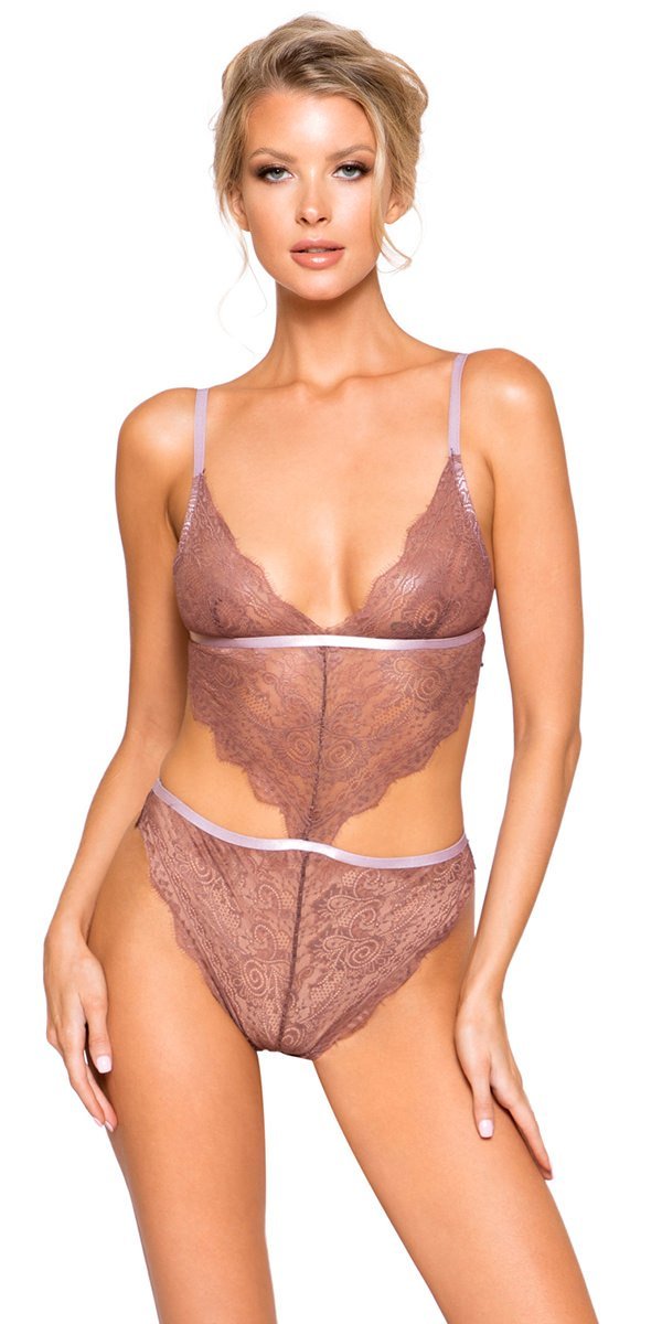 A woman modeling brown lingerie, showcasing a two-piece set with a lingerie top and matching bottoms, highlighting fashion and style.