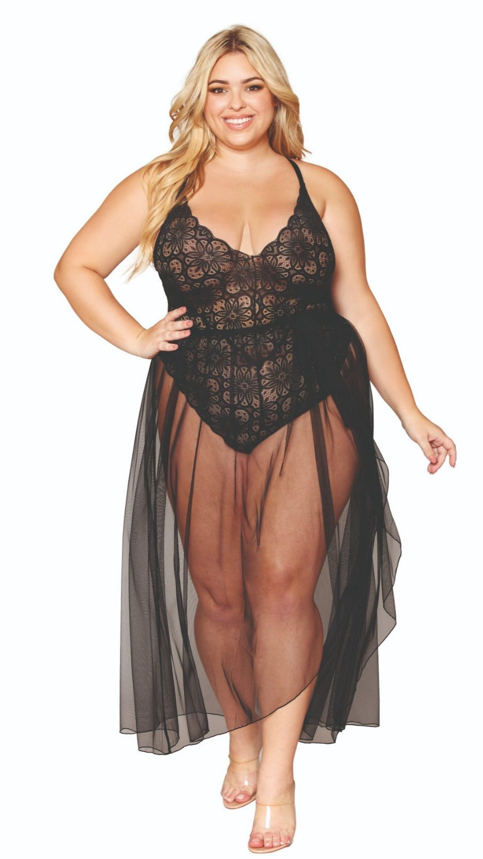 Woman modeling Fabulous Plus Size Lace Teddy and Sheer Skirt Combo, featuring a lace top, tie-front maxi skirt, and adjustable criss-cross straps.