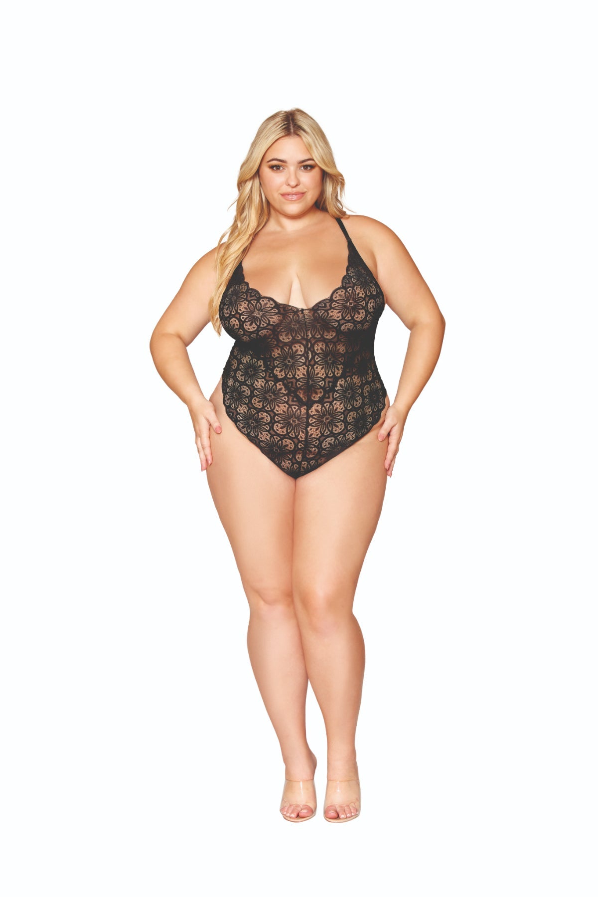 Plus size model in a black lace teddy outfit.
