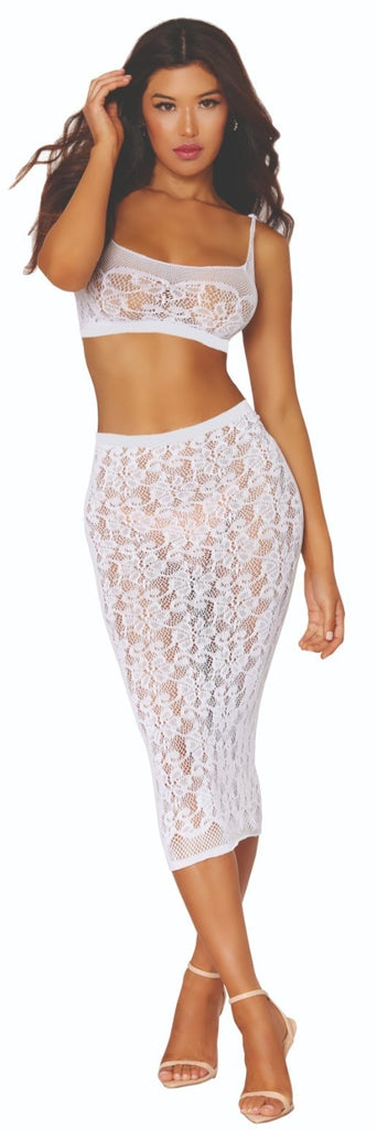 Woman modeling Lace Bralette and Sheer Slip Skirt, showcasing seamless lace and crisscross back detail, exuding elegance and allure in a fashion photoshoot.