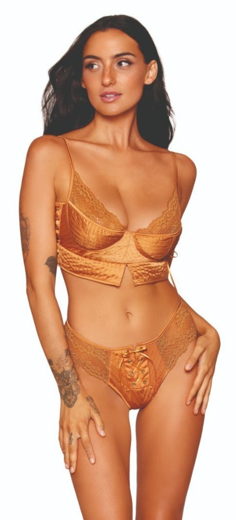 Woman modeling Pintuck Satin Bra and G-string Lingerie Set, featuring underwire cups, adjustable straps, lacy accents, side grommet, and front lace-up details.
