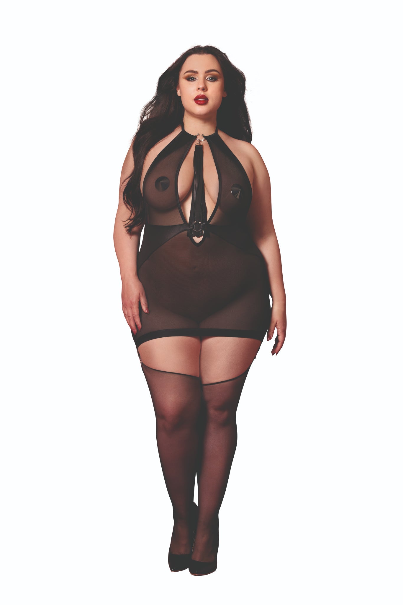 Woman in Plus Size Stretch mesh and faux-leather garter slip set with plunging halter neckline, horseshoe connectors, and side garters, styled with thigh highs and pasties.