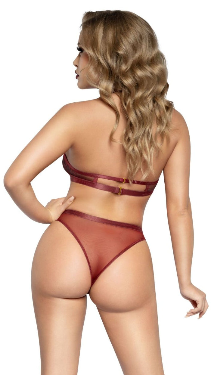 Woman in a burgundy-red lingerie set, showcasing a stretch floral lace bra with double back straps and a criss-cross front panty featuring O-ring details, paired with black high-heeled shoes.