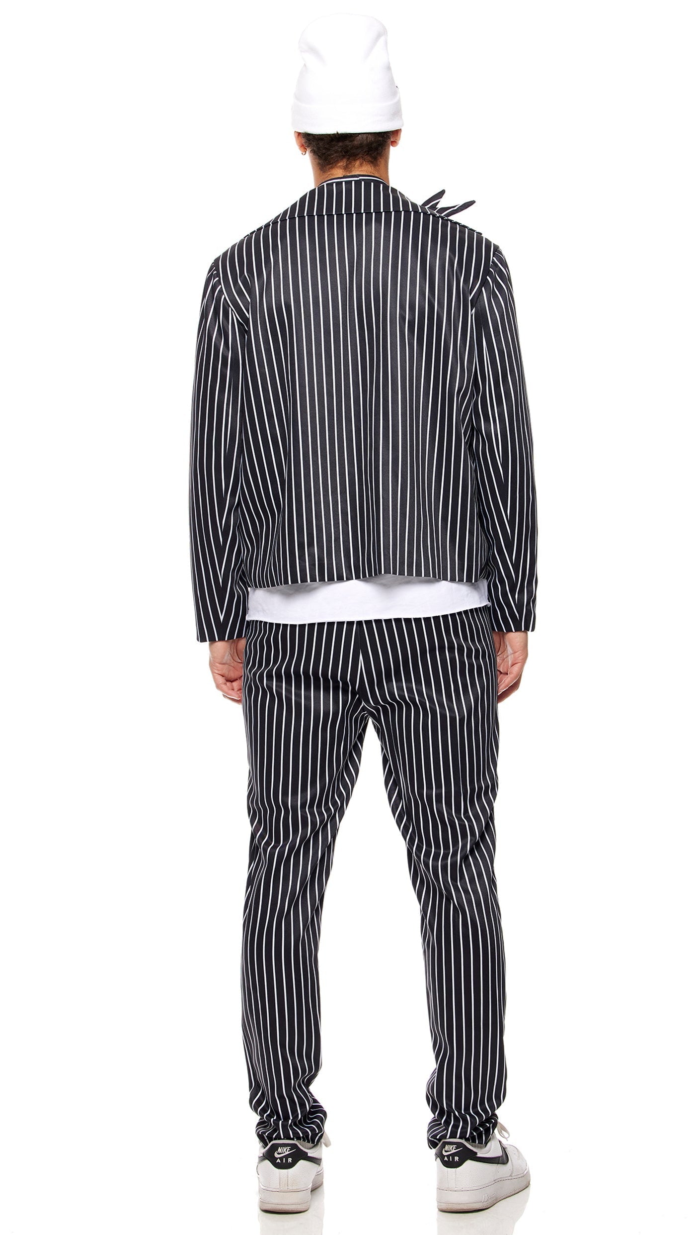 Pumpkin King Men's Movie Character Costume featuring a pinstripe jacket and pants, bat wing choker, and skeleton face beanie.
