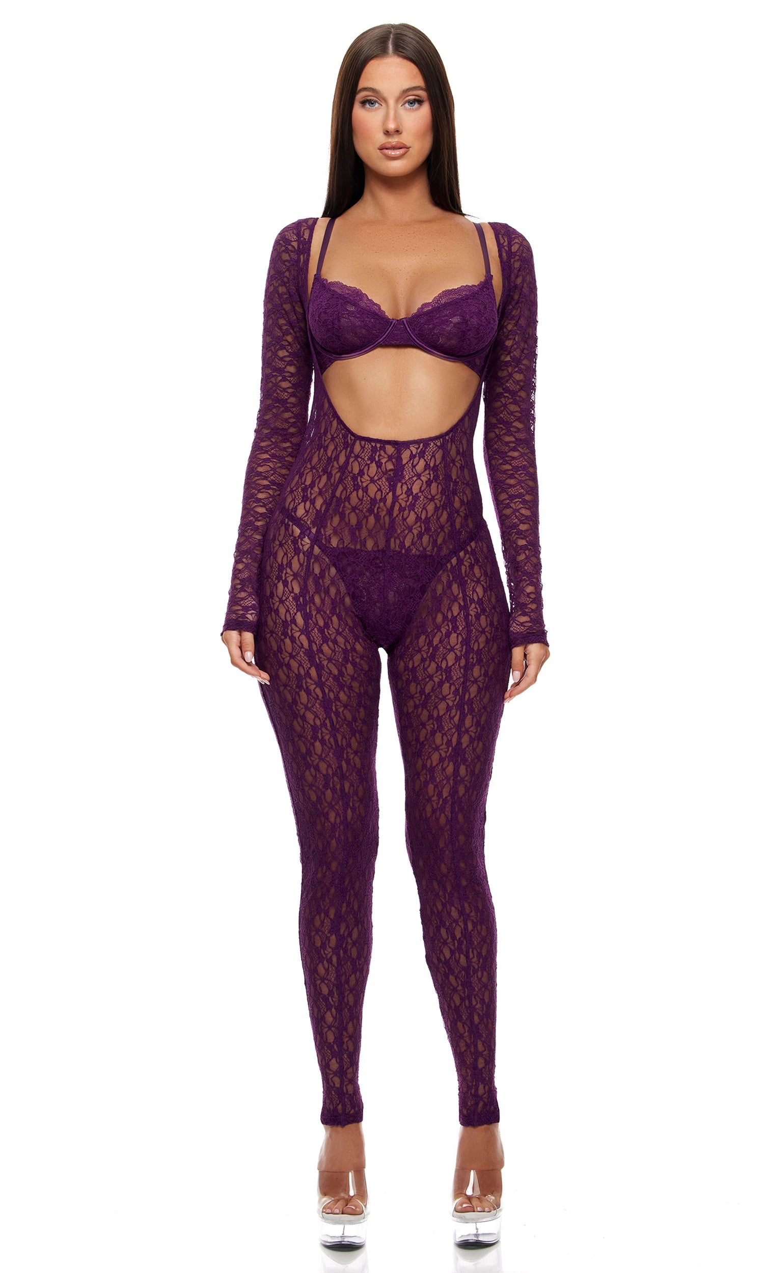 Woman modeling the Feel Me Textured Lace Jumpsuit Lingerie Set featuring a form-fitting lace bodysuit with midriff cut-out, scallop lace half cup bra, and matching G-string panty.