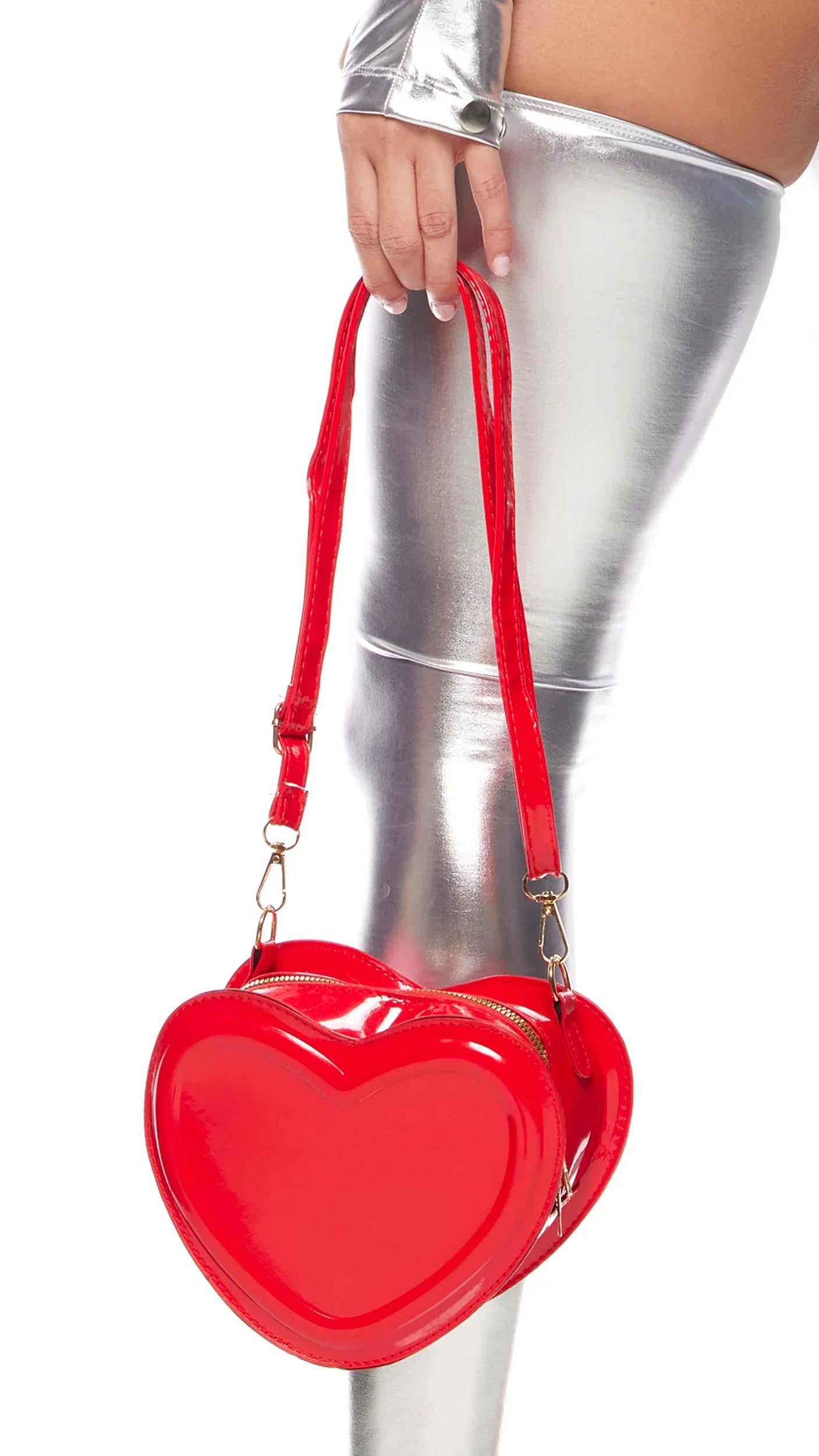 Heart Bag with a zipper opening, featuring a heart shape and adjustable strap, highlighted by close-up views of the zipper and a hand.
