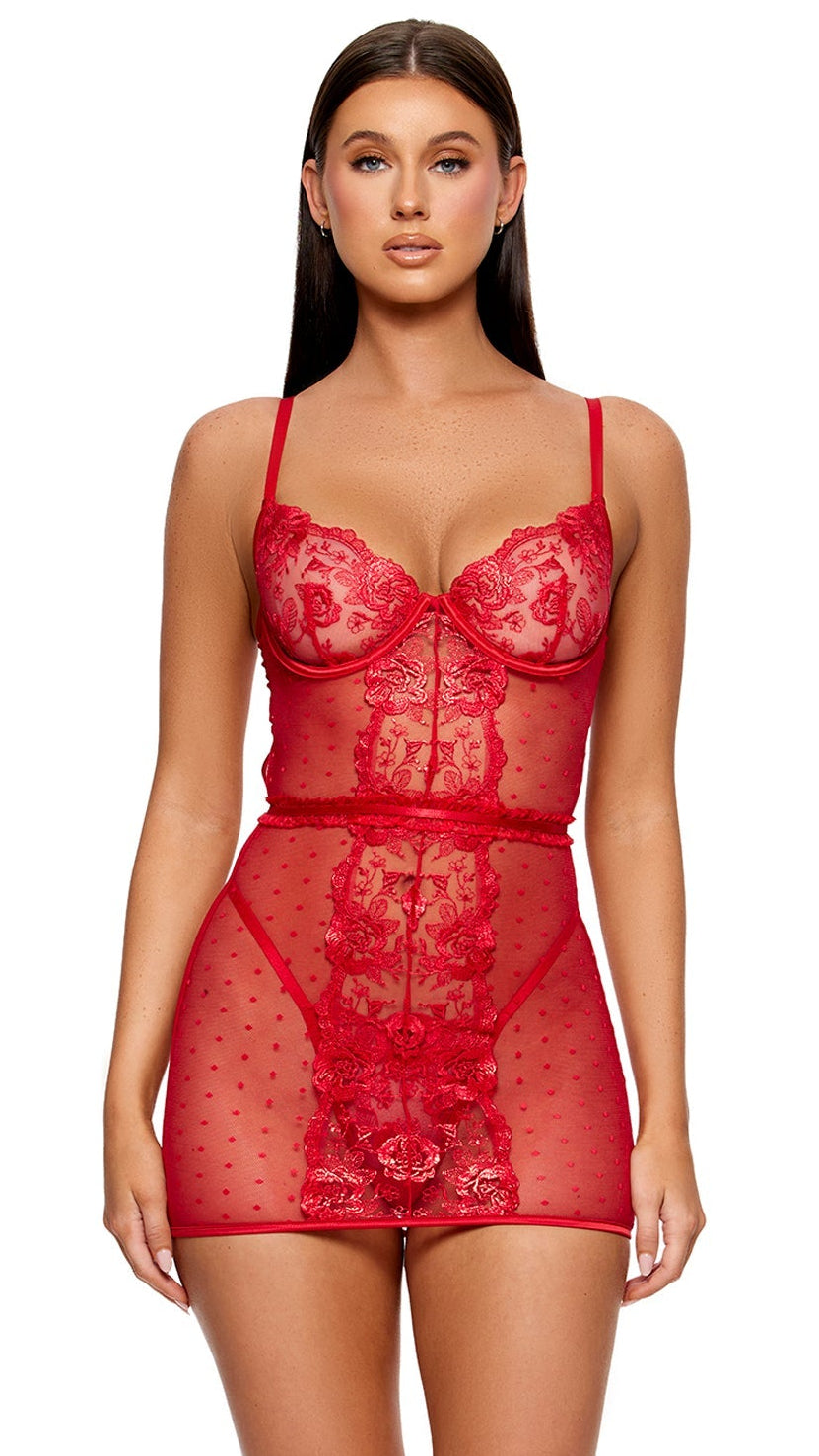 La Vie en Rose Metallic Embroidered Chemise Set modeled, featuring sheer red lace with floral embroidery, underwired cups, and polka-dot mesh. Paired with matching panty and belt, styled with clear platform heels.